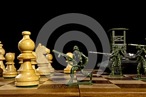 Chess pieces and toy soldiers