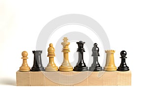 Chess pieces on wooden blocks