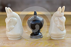 Chess pieces on wooden table, Planing game. chess uniqueness concept on the wooden background