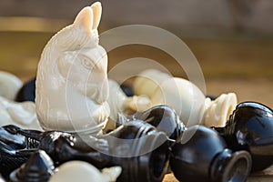 Chess pieces on wooden table, Planing game. chess uniqueness concept on the wooden background