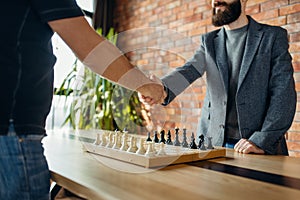 Chess players shake hands before the game