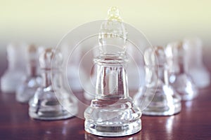 Chess queen in front of other chess pieces. Women leadership and women empowerment concept