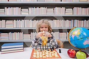 Chess school for kids. Kid playing chess. Child thinking near chessboard. Learning and growing children, childgood. Kids