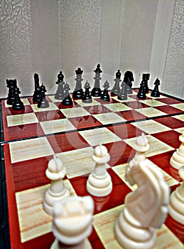 Chess is a table logic game with special figures on a 64-cell board for two rivals, combining elements of art in terms of chess c