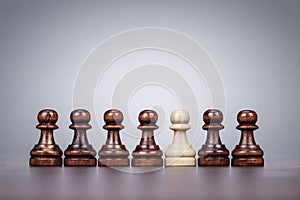 Chess uniqueness concept over grey background