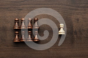 Chess uniqueness concept over grey background