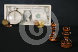 Chess, watches and a banknote.