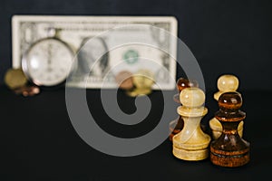 Chess, watches and a banknote.