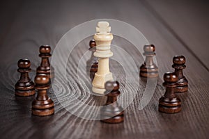 Chess win concept over wooden background