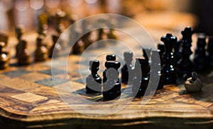 Chess on wooden chessboard