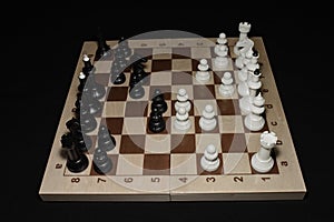 Chessboard with black chessmen as a skill backdrop