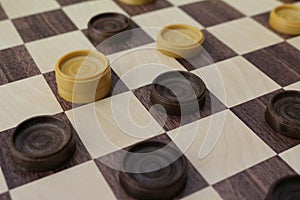 Chessboard and checkers of the game of checkers. photo