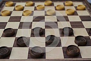 Chessboard and checkers of the game of checkers. photo