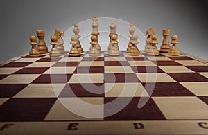 Chessboard with chess pieces.