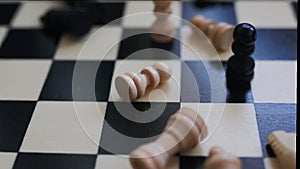 chessboard with combination of white and black wooden chess figures . Top view. High quality footage