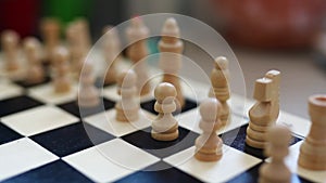 chessboard with combination of white and black wooden chess figures . Top view. High quality footage