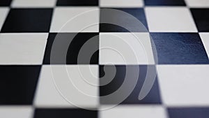 chessboard with combination of white and black wooden chess figures . Top view. High quality footage