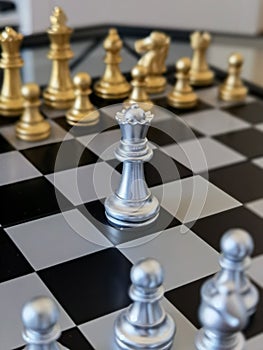 Chessboard with silver Queen on the center