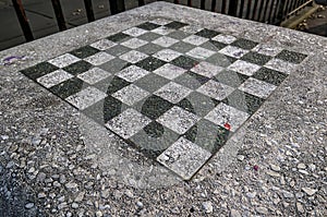 chessboard on a stone table in a public park (brooklyn new york city) chess board checkered squares