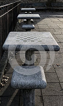 chessboard on a stone table in a public park (brooklyn new york city) chess board checkered squares