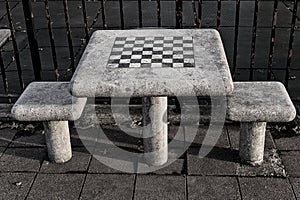 chessboard on a stone table in a public park (brooklyn new york city) chess board checkered squares