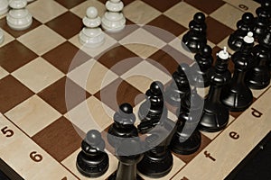 Chessboard under black chessmen as a skill backdrop