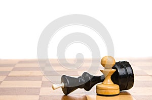 Chessmen on a chessboard photo