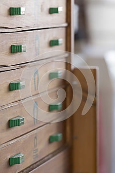 Chest of drawers with green handles and horseshoes