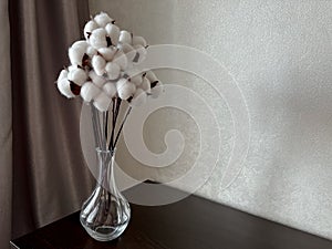 on the chest of drawers you will dig up there is a bouquet of white cotton flowers