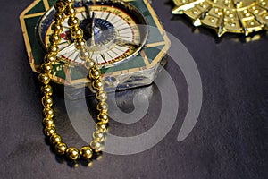 Chest with gold coins, a pirate necklace on a black background