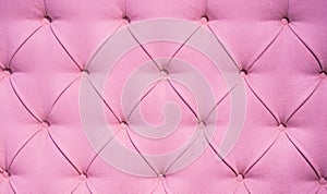 Chesterfield style quilted upholstery backdrop close up. Capitone pattern texture background