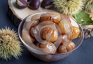 Chestnut dessert and chestnuts on a plate. Traditional delicious Turkish dessert chestnut candies (Kestane Sekeri