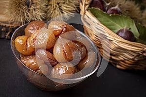 Chestnut dessert and chestnuts on a plate. Traditional delicious Turkish dessert chestnut candies (Kestane Sekeri