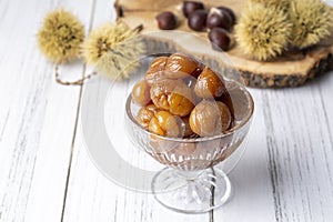 Chestnut dessert and chestnuts on a plate. Traditional delicious Turkish dessert chestnut candies (Kestane Sekeri