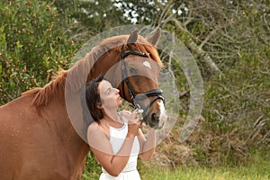 Chestnut horse and young lady