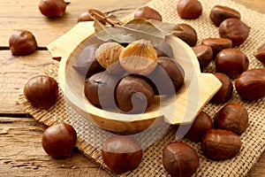 Chestnut on rustic wooden table photo