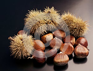 chestnuts on black background