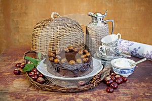 Chestnuts chokolate cake and chestnuts in a basked