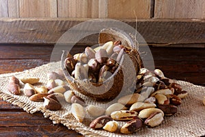 Chestnuts from Para or Brazil nuts, in Portuguese: Castanha-do-ParÃ¡ or Castanha-do-Brasil, in the bowl on a rustic wooden table