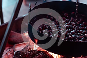 Chestnuts roasting on fire close up