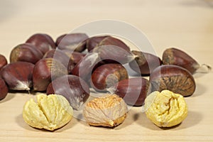 Chestnuts, several of them peeled photo