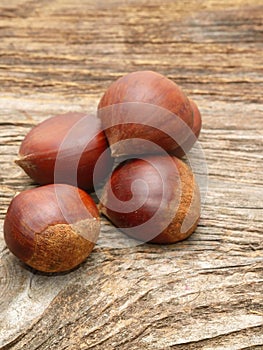 Chestnuts on wooden background