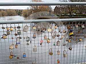 Love padlocks on a wire bridge