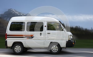 Chevrolet Damas white minibus.