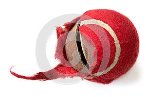 Chewed red ball on a white background. dog toy. the concept of P