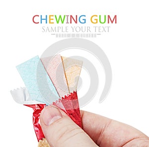 Chewing gum in hand isolated