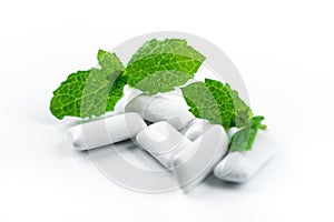 Chewing gum with mint flavor on white background