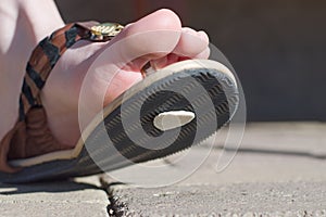 Chewing gum on the shoes, gum spit out on the pavement, step on