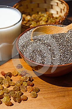 Chia in a bowl, raisins and yogurt. Chia is a plant of the Lamiaceae family