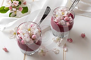 Chia pudding with blueberries and apple blossoms